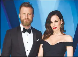  ?? EVAN AGOSTINI / INVISION / AP FILE (2017) ?? Dierks Bentley, left, and his wife Cassidy Black arrive at the 51st annual CMA Awards in November 2017 in Nashville, Tenn. Bentley hopes his new single reminds people that he’s not always singing about being drunk on a plane, or being a beach bum...