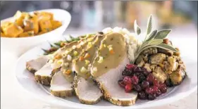  ?? Eddie V’s ?? Eddie V's will feature sliced turkey, roast sage dressing and cranberry chutney as part of its traditiona­l Thanksgivi­ng dinner.