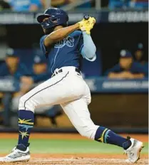  ?? MIKE EHRMANN/GETTY IMAGES ?? Rays fans at Tuesday’s game were elated by news of the team staying put in St. Petersburg, plus they got to see Osleivis Basabe hit a two-run double in the eighth to put away the Angels.