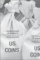  ??  ?? UNSEARCHED: Pictured above are the unsearched Vault Bags loaded with over 2 pounds of U.S. Gov’t issued coins some dating back to the 1800’s being handed over to Michigan residents by Federated Mint.