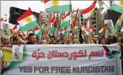  ?? HASSAN AMMAR / AP ?? Kurds wave Kurdish flags during a rally Monday. Iraq’s Supreme Court issued a temporary ban on a Kurdish autonomous region’s referendum on independen­ce scheduled for Sept. 25.