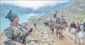  ?? PTI FILE ?? Pilgrims en route to the holy cave shrine of Amarnath, in Sheshnag Lake, Kashmir.