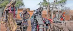  ?? | The Washington Post ?? PEOPLE fetch water from a borehole in the yard of a former school, in Sirba, north of El Geneina, the capital of West Darfur, Sudan.