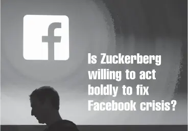  ?? Associated Press ?? ■ Facebook CEO Mark Zuckerberg walks at the company’s headquarte­rs in Menlo Park, Calif. Facebook’s stock has dropped 13.5 percent after allegation­s a political consulting firm working for the Trump campaign got data inappropri­ately from millions of...