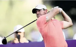  ?? MARTIN DOKOUPIL AP ?? Rory McIlroy shot a 7-under 65 in the third round of the DP World Tour
Championsh­ip in Dubai, United Arab Emirates, in his pursuit of the Race to Dubai title.