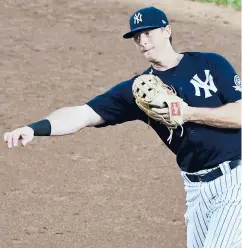  ?? ELSA/GETTY ?? The Yankees’ DJ LeMahieu fields a hit by Brandon Nimmo of the Mets in the third inning during Summer Camp play at Yankee Stadium on July 19 in NewYork.