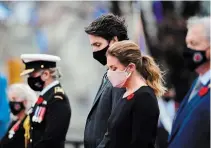  ?? SEAN KILPATRICK, THE CANADIAN PRESS ?? Prime Minister Justin Trudeau and wife Sophie Grégoire Trudeau take part in the Remembranc­e Day ceremony at the National War Memorial in Ottawa on Wednesday.