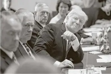  ?? Olivier Douliery / Pool photo via Getty Images ?? A smiling President Donald Trump attends a meeting in the Cabinet Room of the White House on Monday. Trump touted the pace of accomplish­ment his administra­tion has achieved so early in his presidency.