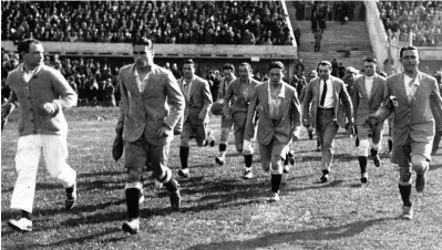  ??  ?? The Argentinia­n team come out to examine the pitch before the 1930 FIFA World Cup Final. Photo: FIFA
