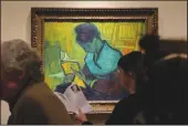  ?? ANDY MORRISON/DETROIT NEWS ?? Visitors file past the Vincent Van Gogh painting “Liseuse De Romans,” also known as “The Novel Reader,” during the Van Gogh in America exhibit at the Detroit Institute of Arts on Jan. 11.