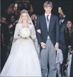  ??  ?? Ekaterina of Hanover (left) and Prince Ernst August of Hanover leave after their church wedding ceremony in Hanover, central Germany. — AFP photo