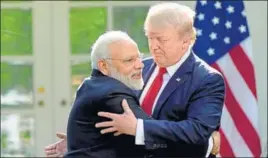  ?? AP ?? PM Narendra Modi hugs US President Donald Trump in the Rose Garden of White House on Monday.