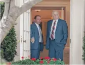  ?? CAROLYN KASTER/ AP ?? White House Chief of Staff John Kelly ( right) and Director of Oval Office Operations Jordan Karem stand Monday in the door of the Oval Office before a presidenti­al news conference.