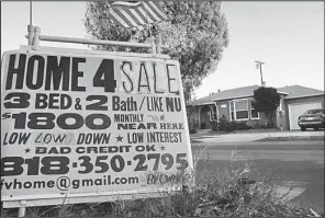  ?? AP/RICHARD VOGEL ?? A sign advertises a house for sale in Los Angeles in January. U.S. home prices jumped in January compared with a year ago as a tight supply of available properties spurred bidding wars in many cities.