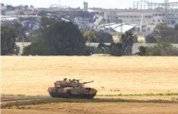  ?? (Amir Cohen/Reuters) ?? A TANK maneuvers near the Israel-Gaza border yesterday.