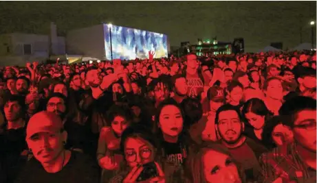  ?? Yi-Chin Lee / Houston Chronicle ?? Fans watch singer Banks at the 2016 Day for Night. This year’s festival will feature Nine Inch Nails, Solange and other musicians.