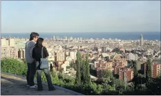  ?? Herald Archive, Detroit Free Press ?? Barcelona, seen here from Parc Guell, is a cultural and culinary magnet for tourists. Fifty years ago, guidebook author Arthur Frommer described it as impoverish­ed and didn’t include it in his tour of Europe.