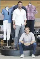  ?? SETH WENIG/ THE ASSOCIATED PRESS ?? Untuckit co-founder Chris Riccobono, left, and CEO Aaron Sanandres say it was hard to find a men’s shirt that could be worn untucked and didn’t look sloppy.