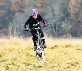  ??  ?? Exciting Lindsey Johnson spoke about her experience­s in the sport of Bikejor – a type of cross country mountain biking as a team with your dog