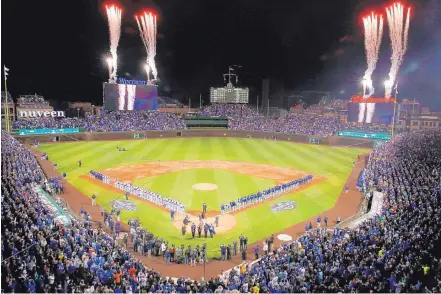  ?? NAM Y. HUH/AP FILE ?? Fans and players watch fireworks during the national anthem before a game between the Cubs and the Dodgers earlier this year. The anthem first took on a deeper appreciati­on during the 1918 World Series between the Cubs and the Boston Red Sox.