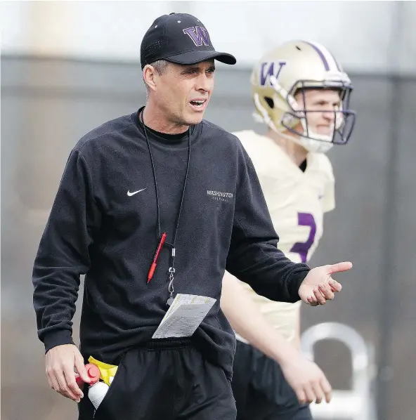  ?? — THE ASSOCIATED PRESS FILES ?? Head coach Chris Petersen’s Washington Huskies are two-touchdown underdogs against No. 1 Alabama in Saturday’s Peach Bowl, the first of two College Football Playoff semifinals this weekend. The winner faces either Clemson or Ohio State.