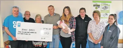  ?? 50_c49coop03 ?? Two-week-old Rosie McAulay, held by her mum Clare Lamont, joined representa­tives from Bonnie Babies at the cheque presentati­on.