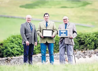  ??  ?? TOP OF THE FLOCKS: From left, RHASS chairman Bill Gray gives Willie and Jimmy Thomson their awards