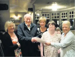  ??  ?? Kind gesture Sandy Kellas, Ella Robertson, Sheila McKnight and Shona Cormack of Parkdale receive their donation from Margaret Keenan