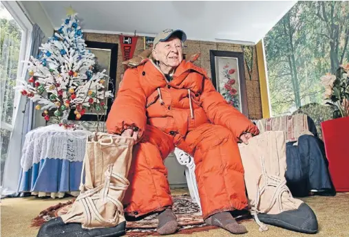  ?? Photo: PHIL REID/FAIRFAX NZ ?? Still fits: Retired scientist Vern Gerard models the polar suit and boots he used during his 1957 trip to Antarctica.