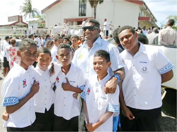  ?? Photo: Jone Luvenitoga ?? Suva Kaji Rugby team with provincial coach Saiasi Fuli (with glasses), after their church service at Raiwaqa Methodist Church, Bryce Street, Suva on August 6, 2017.