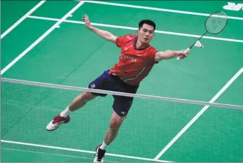  ?? AP ?? China’s Zhao Junpeng reaches for a return during his match against Indonesia’s Anthony Ginting at the Thomas Cup last Thursday. Zhao was defeated in a 3-0 quarterfin­al loss for China