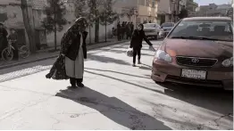  ?? AFP ?? A woman walks at the site where gunmen shot dead two Afghan women judges working for the Supreme Court, in Kabul on Sunday. —