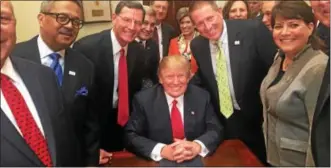  ?? PHOTO COURTESY OF THE NATIONAL ASSOCIATIO­N OF COUNTIES ?? Berks County Commission­ers’ Chairman Christian Leinbach, seen over President Donald Trump’s right shoulder, was among county leaders from across the country invited to attended Trump’s signing of an executive order requiring a review of stream...