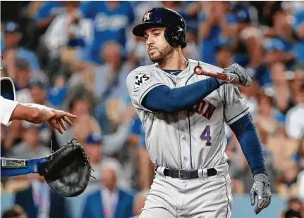  ?? Karen Warren / Houston Chronicle ?? George Springer got used to the frustratio­n after striking out four times in the Astros’ 3-1 loss to the Dodgers in Game 1 on Tuesday.