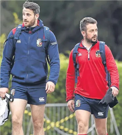  ?? Pictures: Getty. ?? Scotland trio Tommy Seymour, Greig Laidlaw and Stuart Hogg on the way to Lions training yesterday. Below: Lions coach Warren Gatland addresses the media.