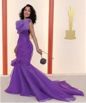  ?? Allen J. Schaben Los Angeles Times ?? ANGELA BASSETT is royal in a purple gown with bow neckline by Jeremy Scott for Moschino.