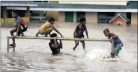  ?? PICTURE: EPA ?? Filipino children frolic in floodwater at a school in the typhoon-hit town of Abulog, Cagayan province.