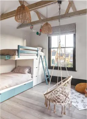  ??  ?? BOYS’ ROOM ‘A swing was the one thing the boys wanted,’ says Elizabeth. ‘We had to have a reinforced beam put in. I’m bracing myself for when they start trying to climb on it.’ Hanging chair, Tectake. Asoral beds, Bobo Kids. Rattan pendant lights, Cox & Cox