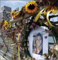  ?? PAUL CHINN — SAN FRANCISCO CHRONICLE VIA AP, FILE ?? In this file photo, flowers and a portrait of Kate Steinle remain at a memorial site on Pier 14in San Francisco. Jose Ines Garcia Zarate, a homeless undocument­ed immigrant acquitted of killing Kate Steinle on a San Francisco pier is scheduled to be...