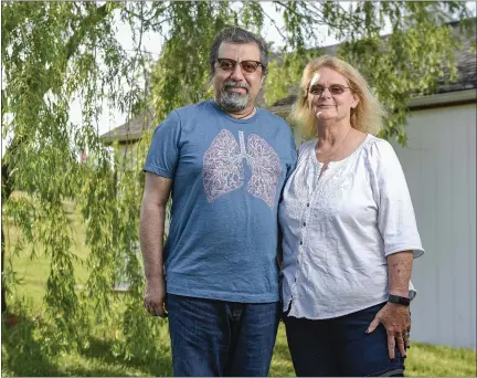  ?? BEN HASTY — READING EAGLE ?? Fred Rahmanian and his wife, Pam, of Berks County are grateful a donor was found so he could undergo a double-lung transplant to replace his lungs that had been destroyed by COVID.