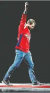  ?? GEOFF BURKE/USA TODAY SPORTS ?? Nationals pitcher Max Scherzer waves to the crowd after dropping the ceremonial first puck prior to a game between the Capitals and the Rangers at Capital One Arena.