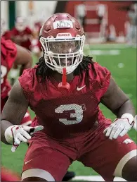  ?? NWA Democrat-Gazette/BEN GOFF ?? Defensive lineman McTelvin Agim warms up Thursday during practice in Fayettevil­le. Agim is among the returning starters this season.