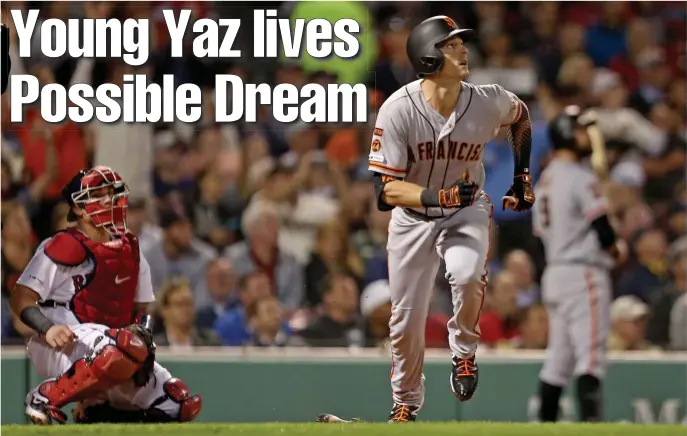 ?? STUART CAHILL / BOSTON HERALD ?? FEEL-GOOD MOMENT: Mike Yastrzemsk­i watches his solo home run to center field in the fourth inning of last night’s game between the Red Sox and Giants at Fenway Park.