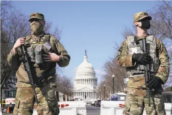  ?? Jacquelyn Martin / Associated Press ?? The Pentagon is reviewing a police request to keep National Guard troops patrolling the U.S. Capitol for another 60 days after evidence of a possible plot by a militia group.