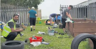  ??  ?? Getting creative Residents came together to construct waste materials into items for the garden