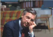  ??  ?? An image of Fred Rogers on the set of “Mr. Rogers’ Neighborho­od” is from the film “Won’t You Be My Neighbor.” JIM JUDKIS/FOCUS FEATURES VIA AP