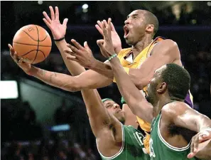  ?? AP Photo/Branimir Kvartuc, File ?? ■ In this Feb. 23, 2007, file photo, Los Angeles Lakers’ Kobe Bryant, top, goes up for a shot between Boston Celtics’ Paul Pierce, left, and Al Jefferson during the first half of an NBA basketball game in Los Angeles. Kobe Bryant, Tim Duncan and Kevin Garnett are all expected to be officially announced today as members of the 2020 enshrineme­nt class for the Basketball Hall of Fame.