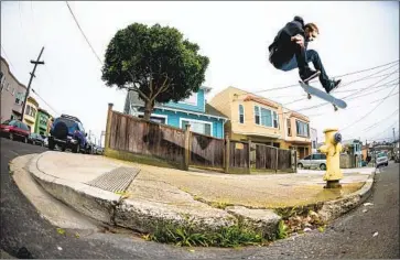  ?? Dan Zaslavsky ?? SKATEBOARD pro and author Walker Ryan does a kickf lip from a curb cut over a hydrant in San Francisco.