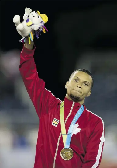  ?? Peter J. Thompson / National Post files ?? Canada’s Andre De Grasse celebrates his win Tuesday in the men’s 100-metre final during
the Pan Am Games in Toronto. Next up is the world championsh­ips in Beijing.