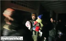  ??  ?? A civilian evacuated from Allepo during ceasefire on Monday, Dec 19